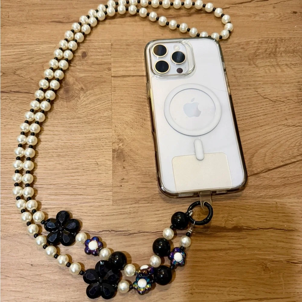 Elegant White and Black Phone Chain with Pearl Strap